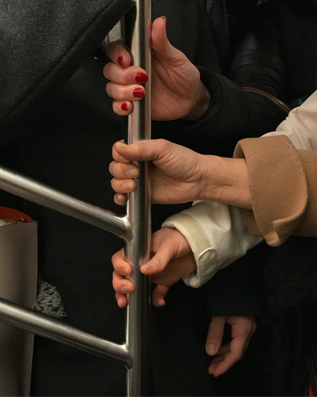 HANDS IN SUBWAY